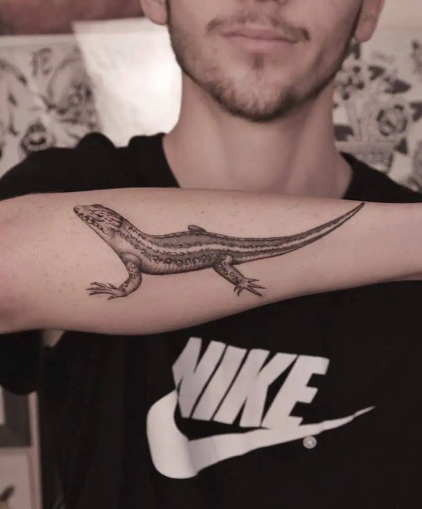 Lizard tattoo on the forearm for men