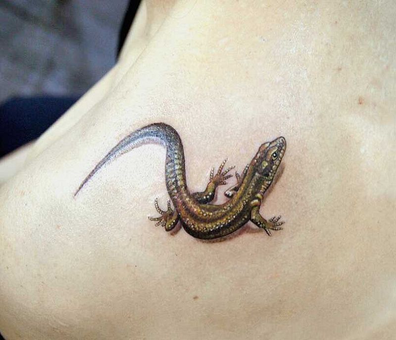 Lizard tattoo on the arm for men