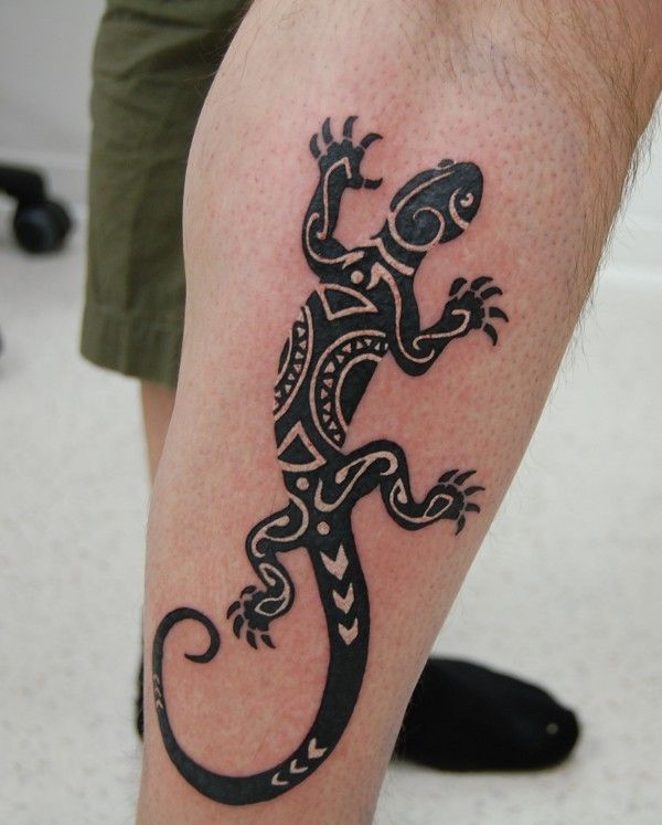 Lizard tattoo on the shin for men