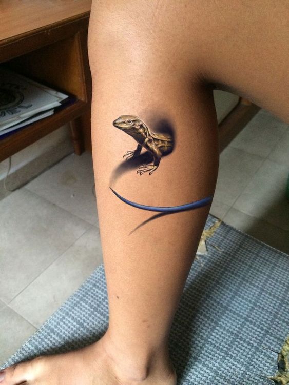 Lizard tattoo on the shin for women