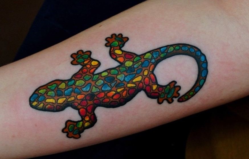 Colored lizard tattoo on the forearm for men