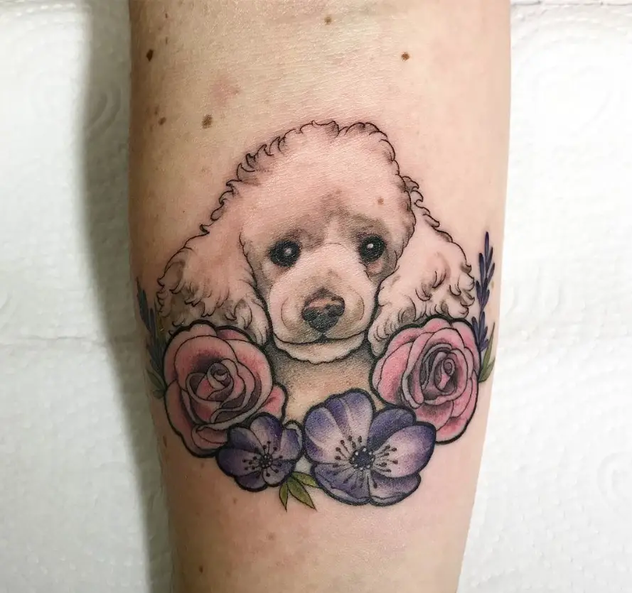 Tattoo of a dog on the forearm for women