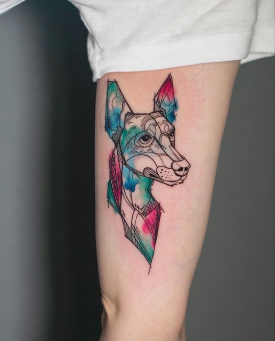 Tattoo of a dog on the shoulder for women