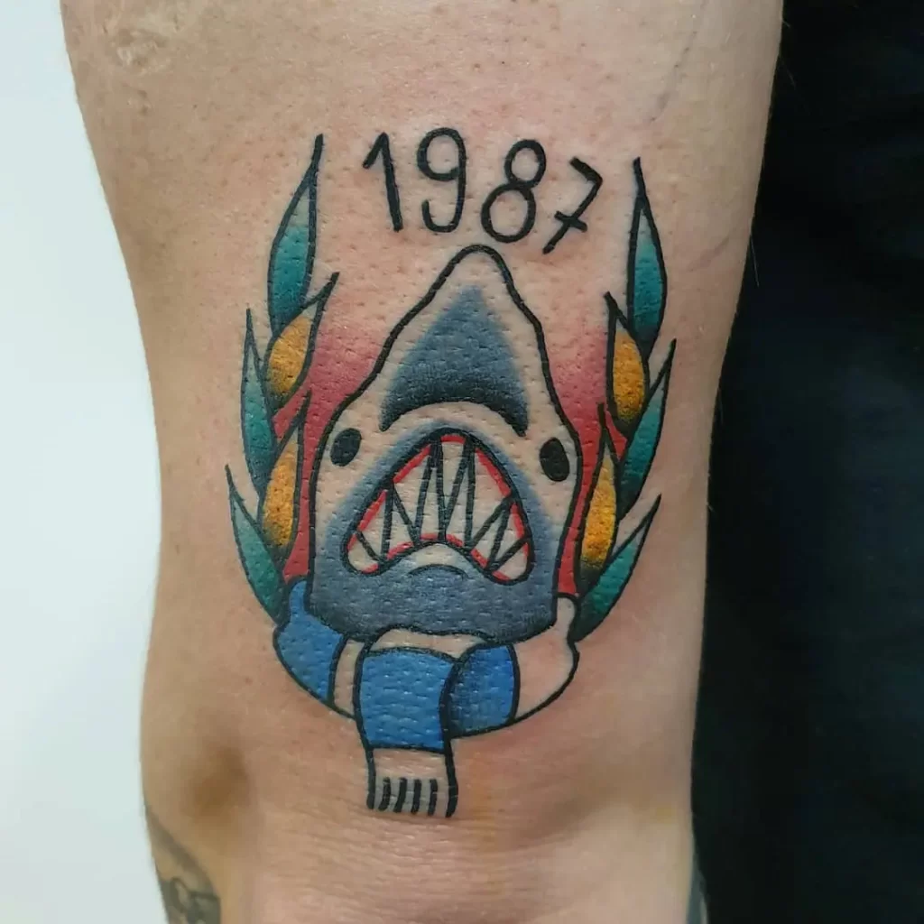 Colorful shark tattoo on the shoulder for men