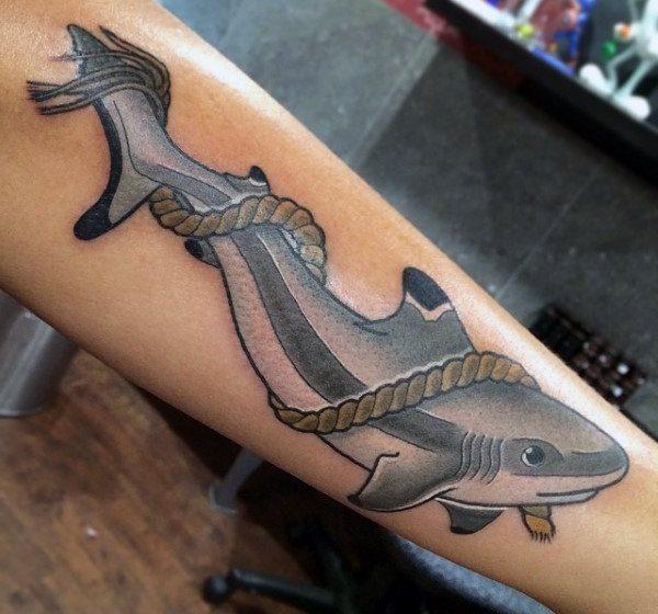 Colorful shark tattoo on the arm for women