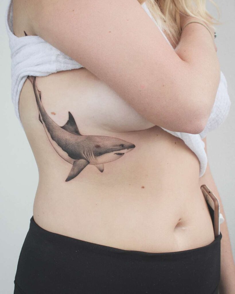 Large shark tattoo on the side for women