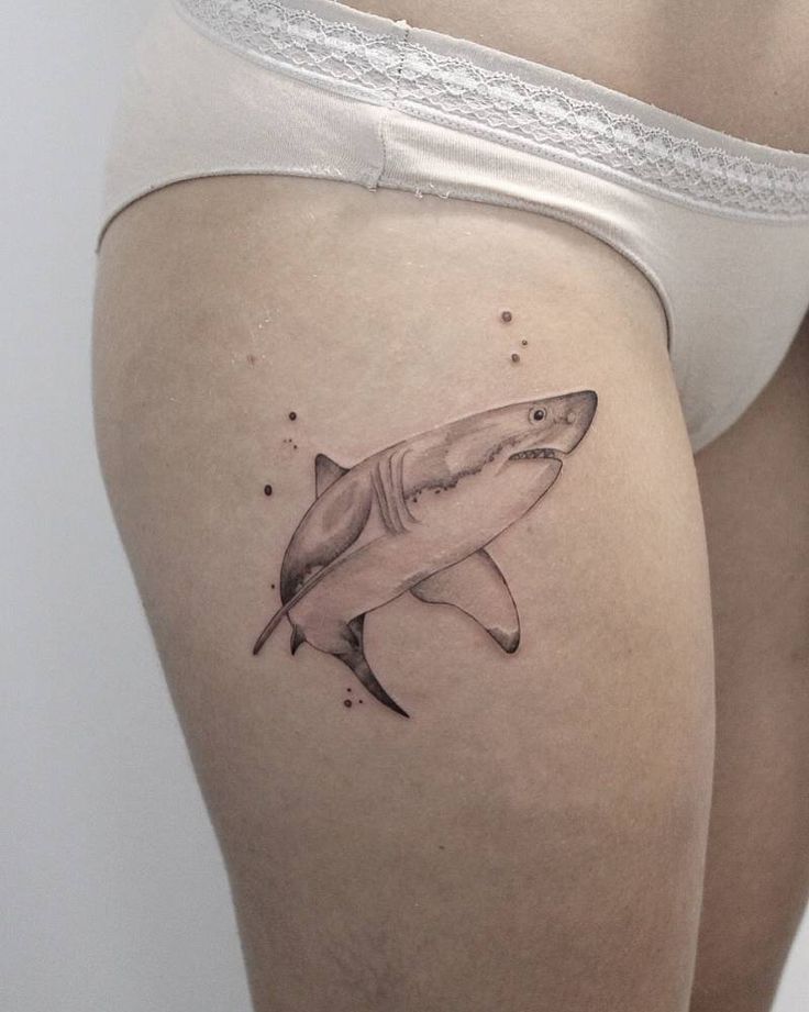 Shark tattoo on the hip for women