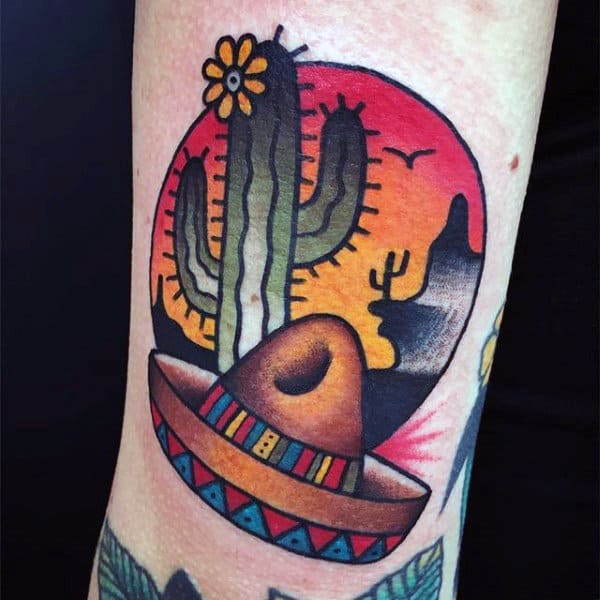 Colorful tattoo of a cactus and a hat on the arm for men