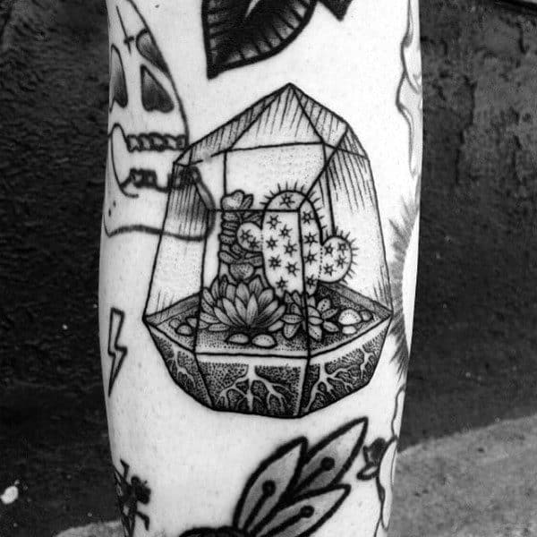 Tattoo of a cactus on the leg for men