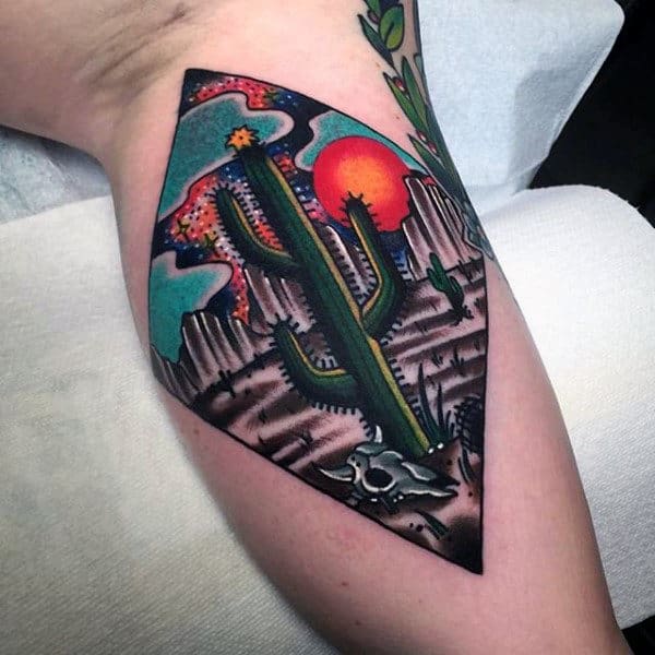 Colorful cactus tattoo on the leg for women