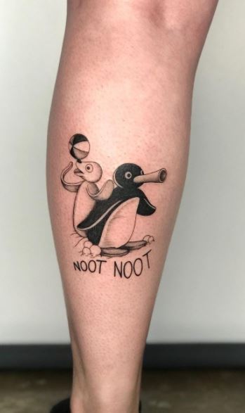 Tattoo of a penguin on a calf for men