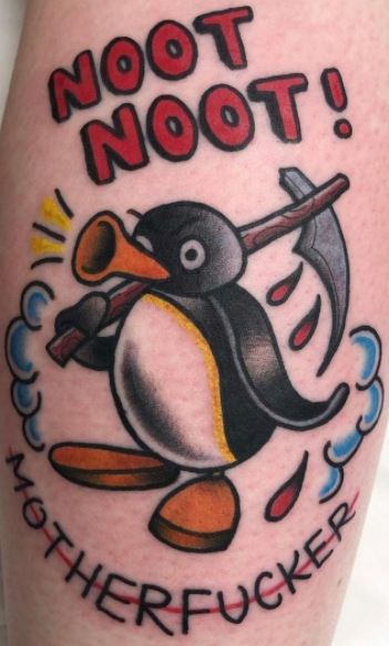 Tattoo of a penguin on a calf for men