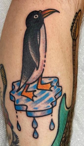 Tattoo of a penguin on a calf for men