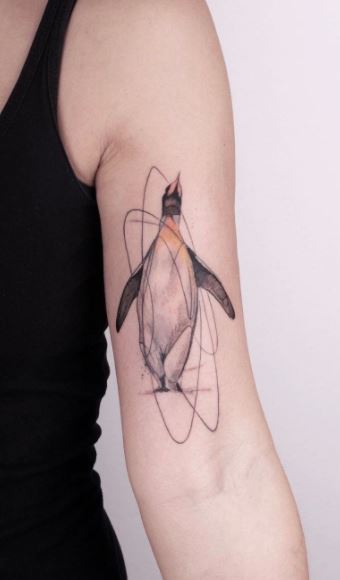 Penguin tattoo on the shoulder for women