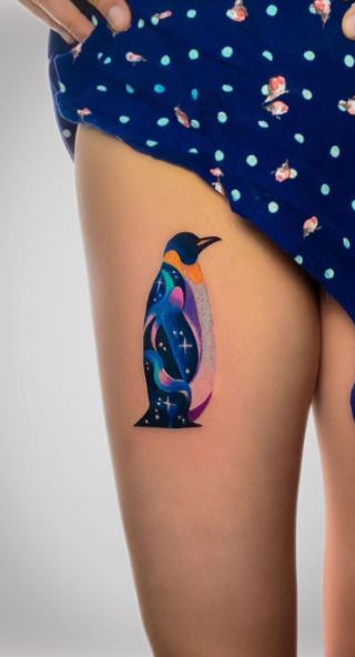 Penguin tattoo on the thigh for women