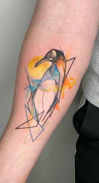 Tattoo of a penguin on the forearm for men