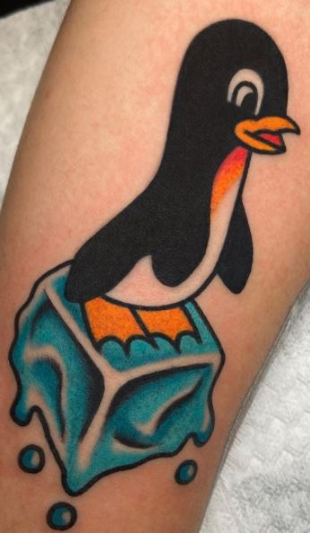 Penguin tattoo on the forearm for women