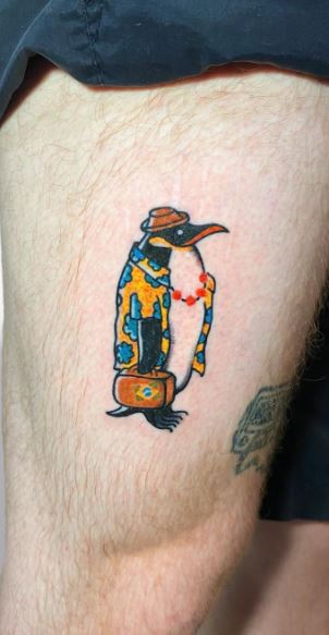 Penguin tattoo on the thigh for men