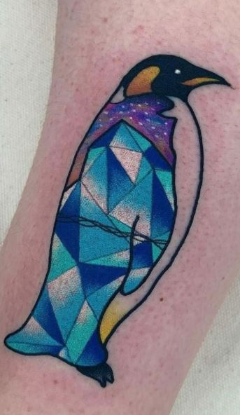 Tattoo of a penguin on the leg for women