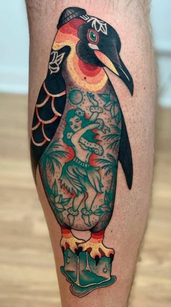 Tattoo of a penguin on the shin for men