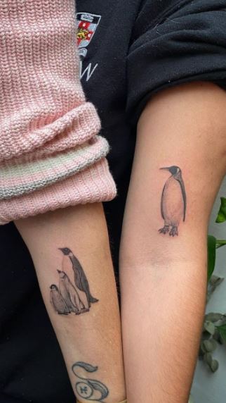 Penguin tattoo on the arms