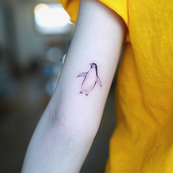 Penguin tattoo on the shoulder for women Penguin tattoo on the shoulder for women