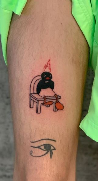 Tattoo of a penguin on a calf for men