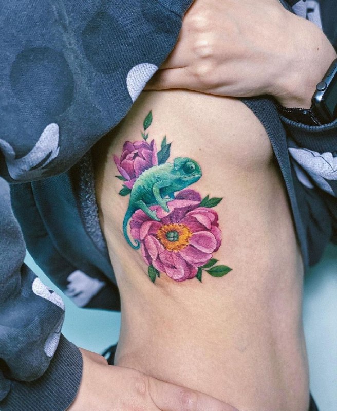 Chameleon tattoo with flowers on the side for women