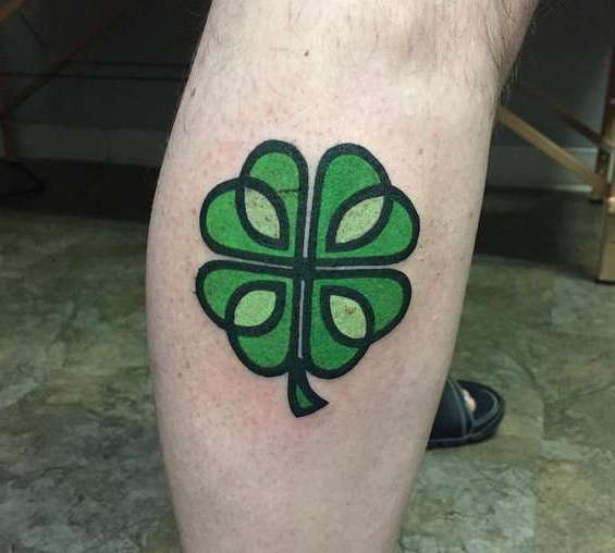 Colored shin clover tattoo for men