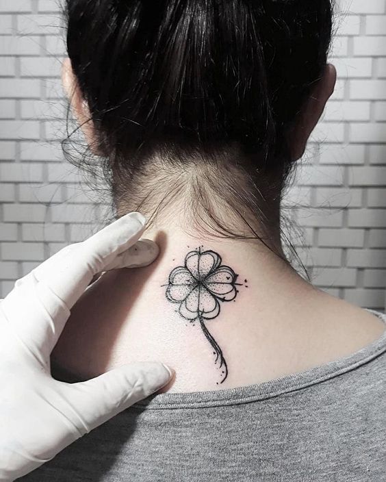 Tattoo clover on the back for women