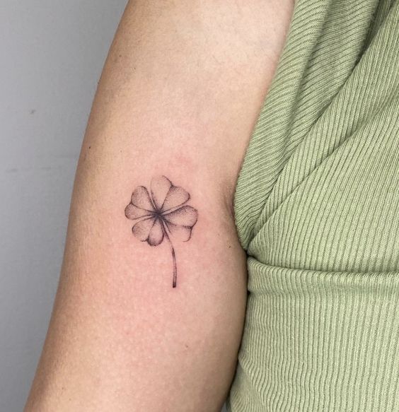 Clover tattoo on the shoulder for women