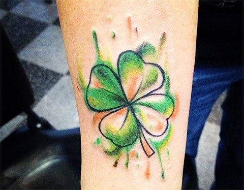 Colorful clover tattoo on the arm for women