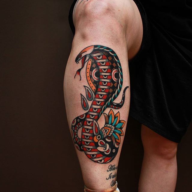 Colored cobra tattoo on the shin for men