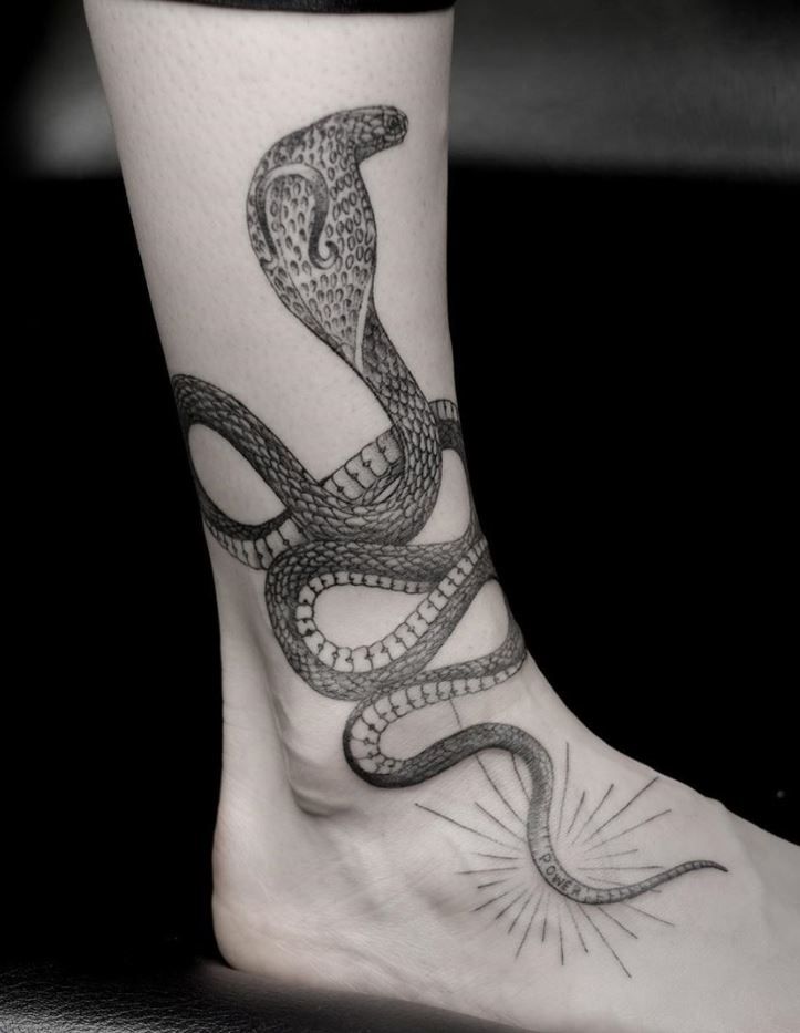 Cobra tattoo on the leg for men