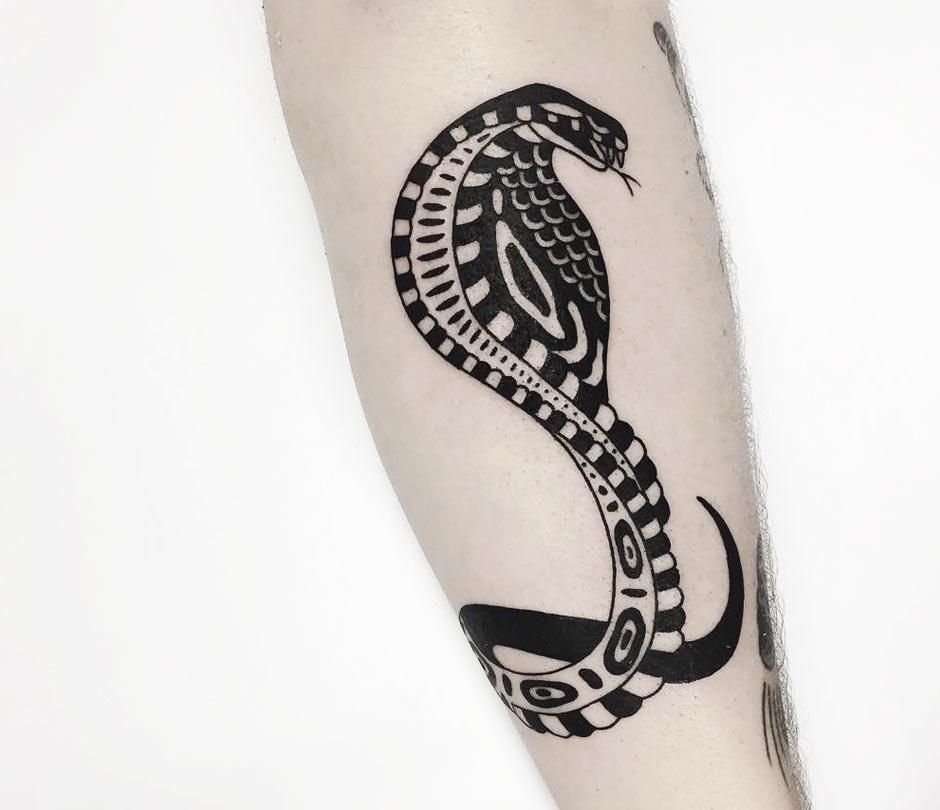 Cobra tattoo on the forearm for women