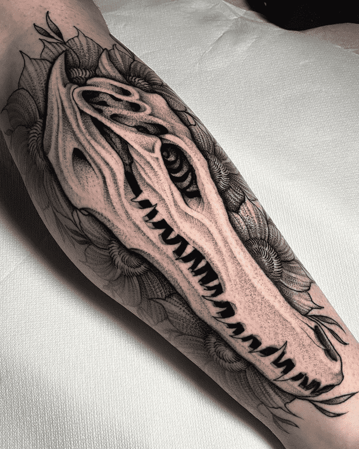 Crocodile skull tattoo on the arm for men