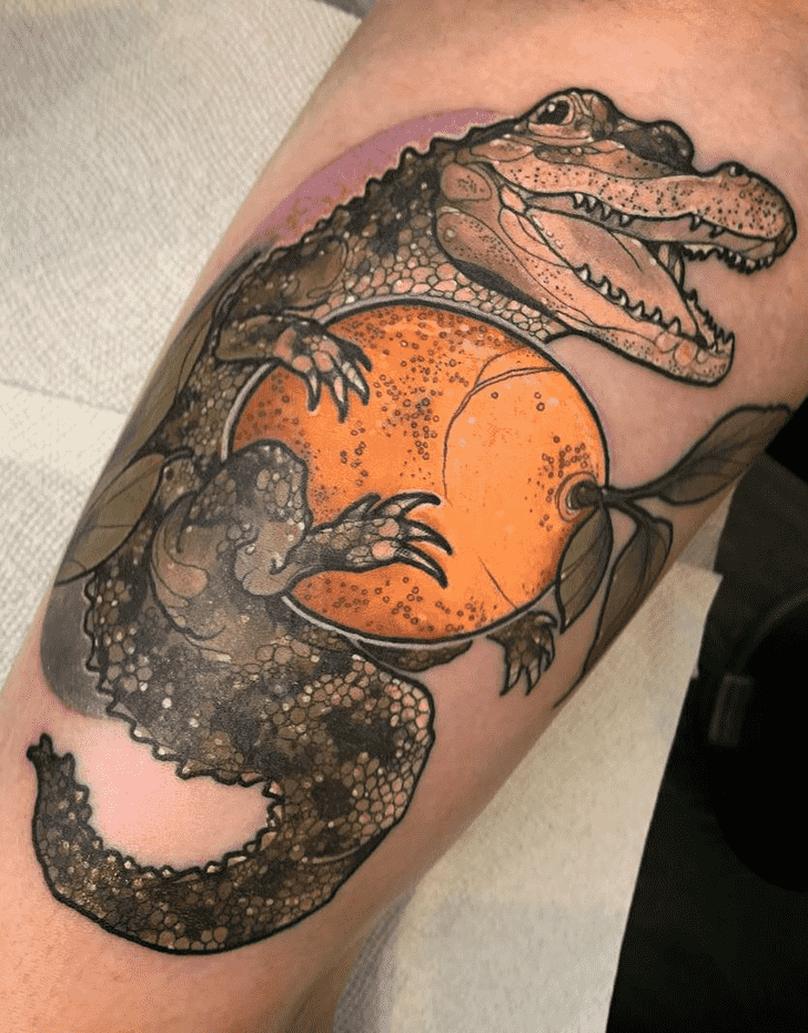 Tattoo of a crocodile on the leg for men