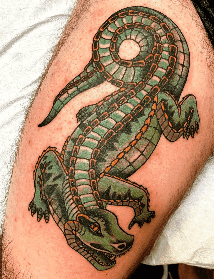 Crocodile tattoo on the shin for men