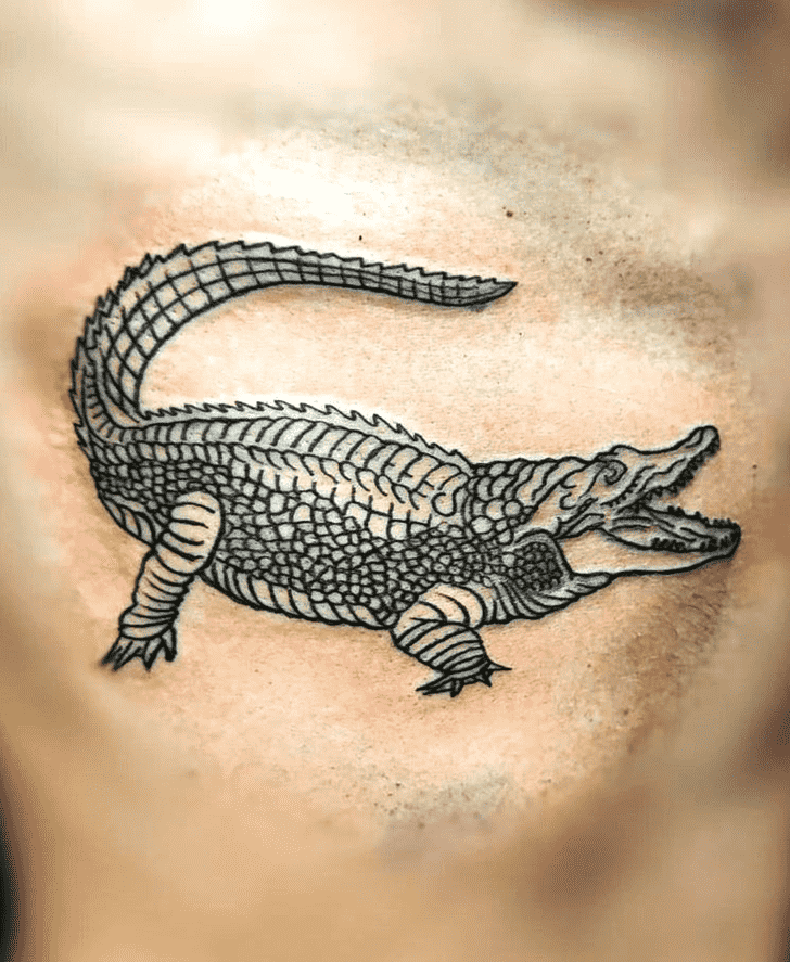 Crocodile tattoo on the knee for men