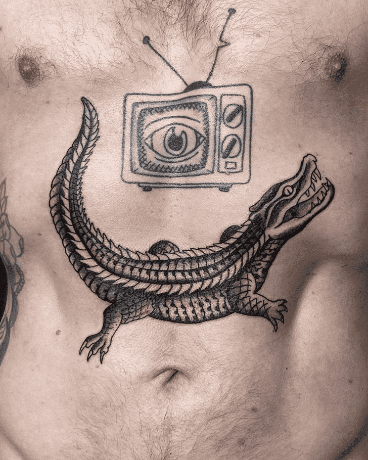 Tattoo of a crocodile on the stomach for men