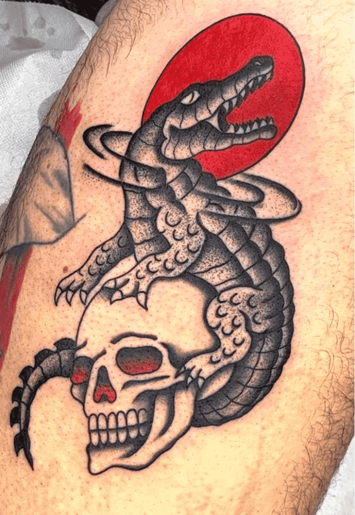 Tattoo of a crocodile on the leg for men