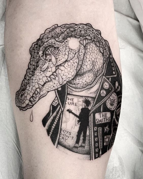 Crocodile tattoo on the shin for men