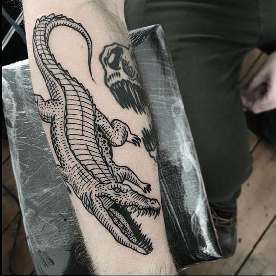 Crocodile tattoo on the forearm for men