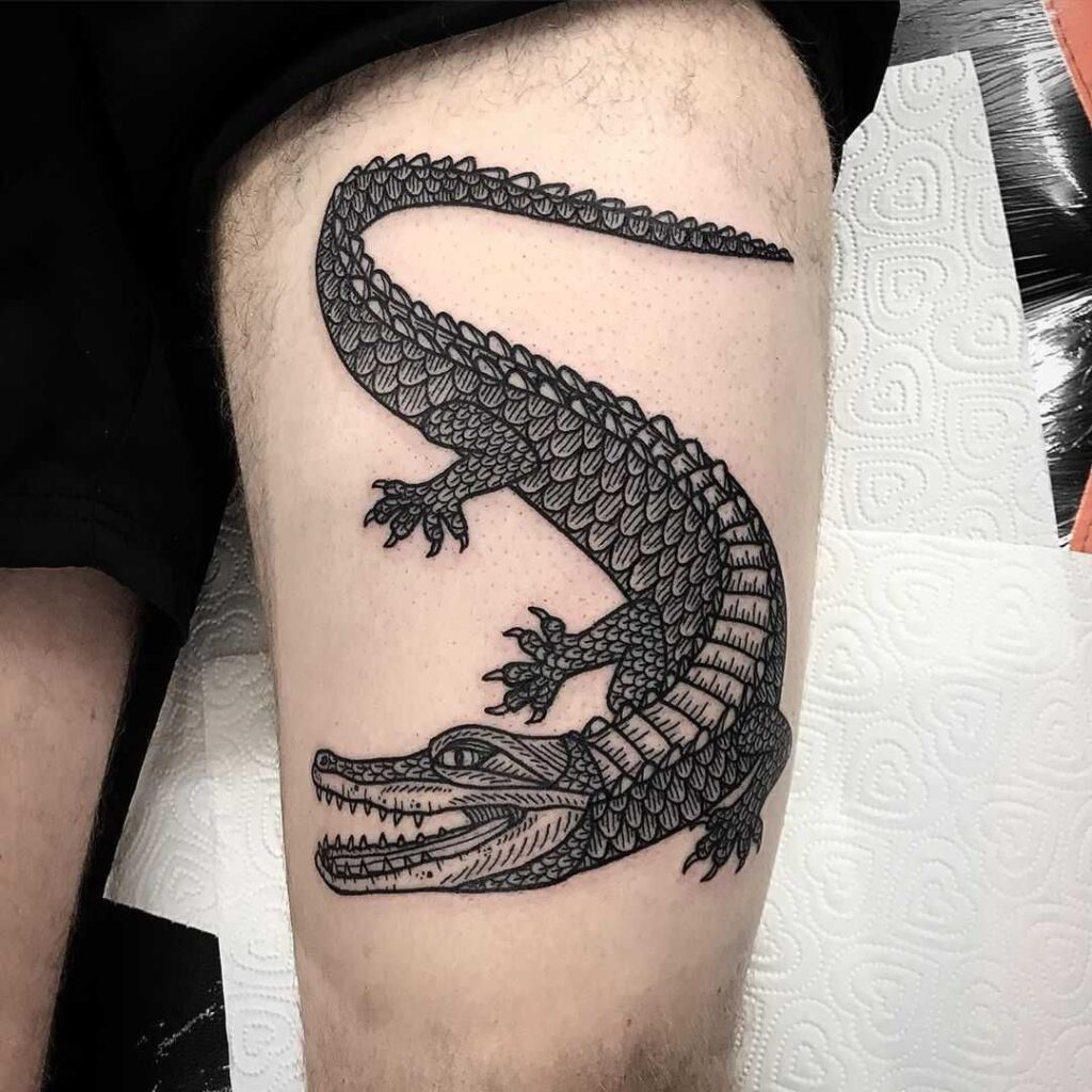 Crocodile tattoo on the thigh for men