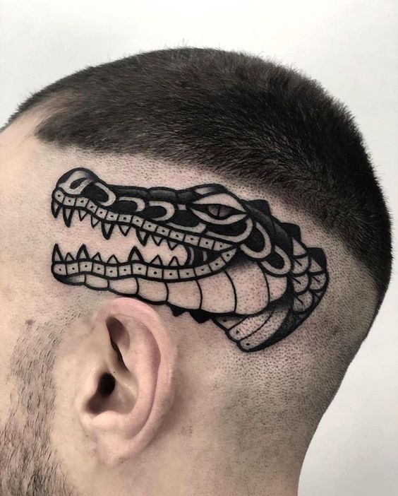 Crocodile tattoo on the head