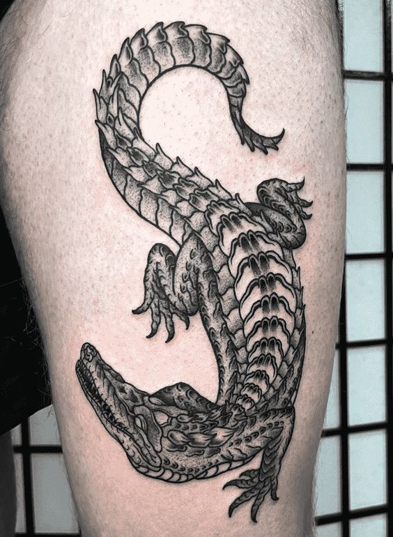 Crocodile tattoo on the thigh for men