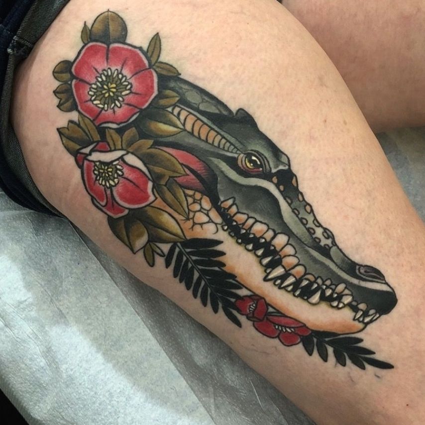 Crocodile tattoo on the thigh for women