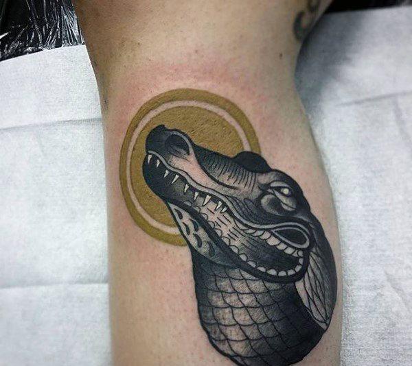 Crocodile tattoo on the shin for men