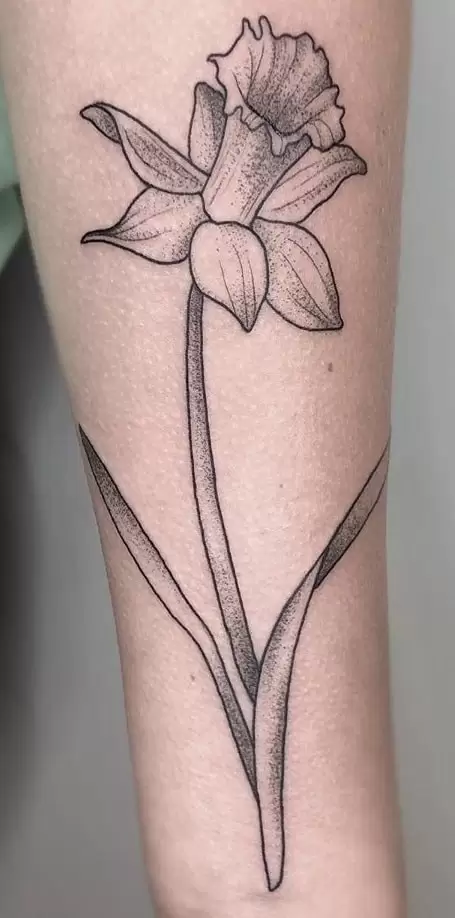 Large daffodil flower tattoo on the shoulder for women