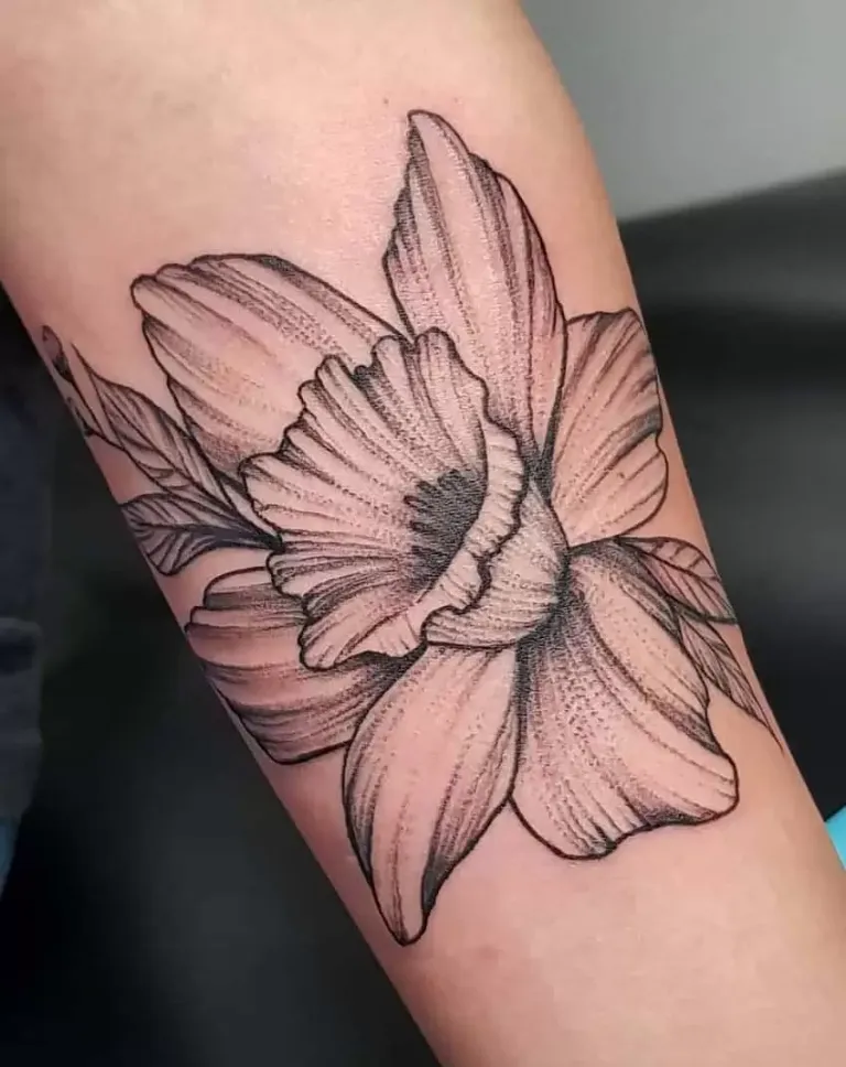 Large daffodil flower tattoo on the forearm for women